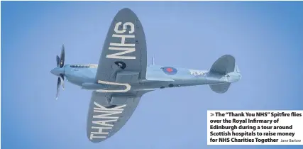  ?? Jane Barlow ?? > The “Thank You NHS” Spitfire flies over the Royal Infirmary of Edinburgh during a tour around Scottish hospitals to raise money for NHS Charities Together