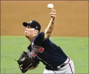  ?? LYNNE SLADKY / AP ?? Starter Robbie Erlin retired 12 of 13 Marlins batters, earning his five K’s against the first 10 batters Sunday in Miami. Manager Brian Snitker called it “refreshing” to see the ball delivered over the plate.