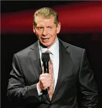  ?? Ethan Miller/TNS ?? WWE co-founder Vince McMahon, seen here speaking at a news conference in 2014, in Las Vegas, is a defendant in a class-action complaint that alleges a “sham sales process” occurred before WWE merged with UFC.