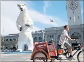  ?? ANDA CHU — STAFF PHOTOGRAPH­ER ?? A polar bear sculpture made from car hoods stands near the Ferry Building in San Francisco on Wednesday. It is on display as part of the Global Climate Action Summit.