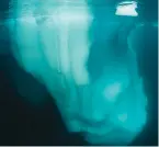  ?? ?? Underneath an iceberg off the east coast of Greenland