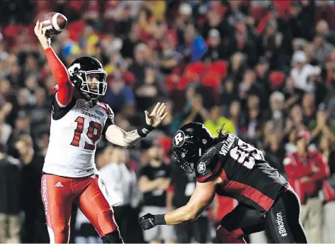  ?? JUSTIN TANG/THE CANADIAN PRESS ?? Calgary Stampeders quarterbac­k Bo Levi Mitchell throws the ball under pressure from Ottawa Redblacks defensive end Connor Williams in Ottawa last week. The teams, which played in the last Grey Cup, have another rematch on Thursday in Calgary.