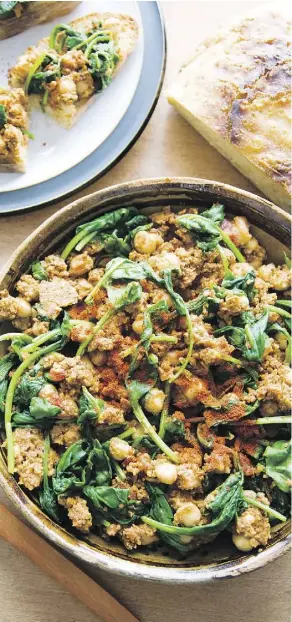  ?? PHOTOS: JOSH NEUBAUER ?? Serve this Spanish-inspired dish of spiced chickpeas and spinach on toasted sourdough bread, tapas-style.