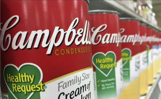  ?? John Raoux/Associated Press ?? Campbell’s soups can be seen on display at a supermarke­t in Orlando, Fla., in 2017. Campbell Soup Co. is buying more ingredient­s amid a boom in demand for pantry staples.