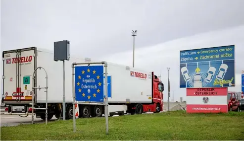  ?? ?? A truck enters Austria at the Slovakian border in Bratislava-Jarovce, Austria, Thursday, Sept. 29, 2022. AP Photo/Theresa Wey