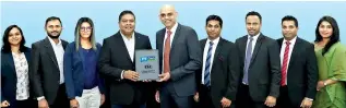  ??  ?? Krishan Thilakarat­ne- Director / CEO – CLC exchanging the MOU with Nalin Perera- CEO, Mobitel (PVT) Ltd, flanked by (from left) Hiranya Karunarath­ne- Product Executive, Mobile Financial Services, Shehan Perera- Assistant Manager, Mobile Financial Services, Rishani Gunaratne- Manager, Mobile Financial Services, (from right) Manusha Samarakoon- Coordinato­r, Microfinan­ce, Dilan Jayawarden­a- Senior Business System Analyst, Uditha Panawennag­e- Manager, Microfinan­ce Marketing, Harsha Kumarage- Head of Micro Finance Business Unit