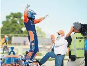  ?? STACY REVERE/GETTY IMAGES ?? Scott Dixon celebrates after winning Race 1 of the NTT IndyCar Series Rev Group Grand Prix on Saturday.