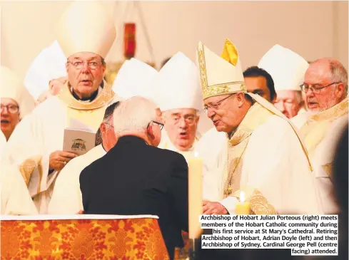  ?? ?? Archbishop of Hobart Julian Porteous (right) meets members of the Hobart Catholic community during his first service at St Mary's Cathedral. Retiring Archbishop of Hobart, Adrian Doyle (left) and then Archbishop of Sydney, Cardinal George Pell (centre facing) attended.