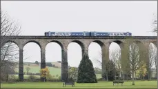  ?? PICTURES: JONATHAN GAWTHORPE. ?? RAILWAY GEM: Rowena Chantler at Penistone railway station, main. The line is one of the county’s most scenic, inset.