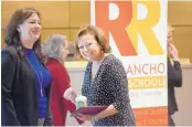  ?? MARLA BROSE/JOURNAL ?? Gov. Susana Martinez, center, greets some of the Rio Rancho students who attended a news conference Thursday announcing that high numbers of NM students have taken Advanced Placement courses.