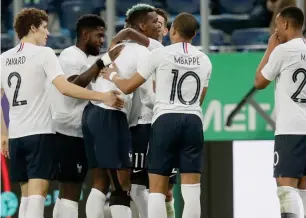  ?? AP ?? France’s Paul Pogba (third left) celebrates with teammates after scoring his side’s second goal during the friendly match between Russia and France at the Saint Petersburg stadium on March 27. —