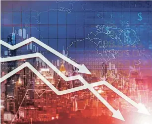  ?? Picture: 123RF/NINRUT ?? FALLING: Chart businesses falling behind on the cityscape background.