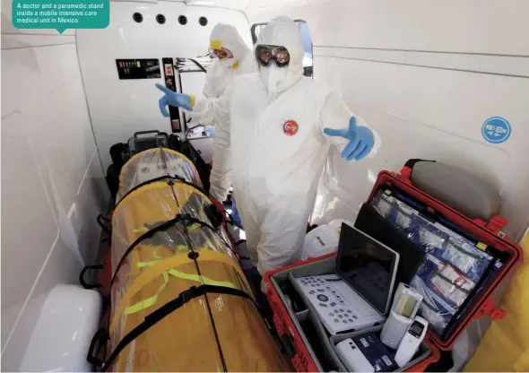  ??  ?? A doctor and a paramedic stand inside a mobile intensive care medical unit in Mexico.