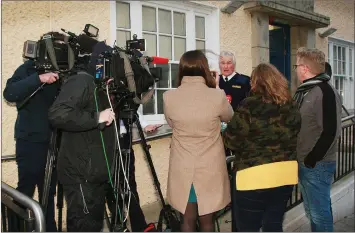  ??  ?? Reporters outside Gorey Garda Station on Wednesday evening.