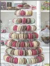  ?? The New York Times/ SARA ESSEX BRADLEY ?? A display of treats adds color to Petit Paris Market, a shop offering French sweets on Magazine Street in New Orleans.