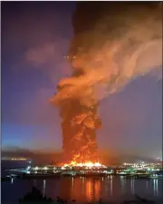  ?? (AP/Dan Whaley) ?? A warehouse burns Saturday morning at Fisherman’s Wharf in San Francisco. Video at arkansason­line.com/524pier/.