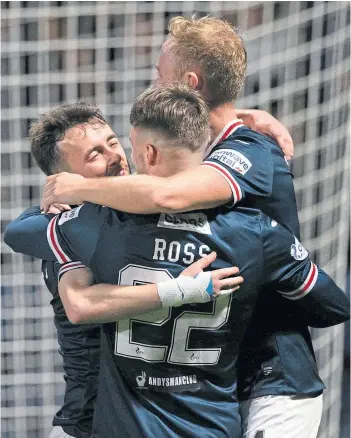  ?? ?? MAGIC OF CUP: Hat-trick hero Aidan Connolly celebrates third goal with team-mates.