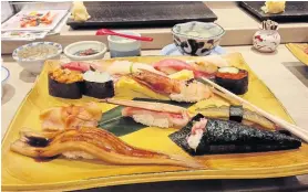  ??  ?? ABOVE
The Chef’s Special sushi at Midori Sushi in Ginza is a modest
2,800 yen.