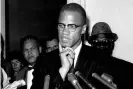  ?? Photograph: AP ?? Malcolm X speaks to reporters in Washington in 1963. He was killed on 21 February 1965, at the Audubon Ballroom in Harlem, as he was beginning a speech. He was 39.