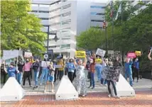  ?? KENNETH K. LAM/BALTIMORE SUN ?? A local group rallies in support of access to abortion at the Federal Courthouse on Lombard Street.