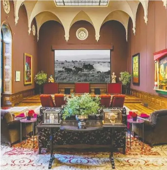  ??  ?? This grand ballroom in the home that once belonged to TV and film composer Danny Elfman and his wife, actress Bridget Fonda, has high ceilings and oversized murals in this space that doubles as a movie theatre.