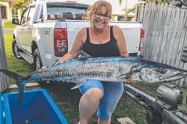  ??  ?? NICE ONE: Karen Hancock used a garfish bait to fool this enormous 152cm mackerel at West Point.