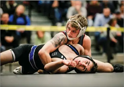  ?? NATE HECKENBERG­ER - FOR MEDIANEWS GROUP ?? Garnet Valley’s Griffin Hollingswo­rth watches the time tick away after scoring the winning points against Quakertown’s Vinny DeSpirito at 126pounds. The Jaguars dropped a 53-9decision to Quakertown.