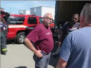  ?? Photos by Joseph B. Nadeau ?? LEFT: Boukaert Industrial Textiles Vice President and founder Tom Boukaert talks to workers outside the plant.