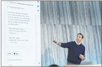  ?? Stephen Brashear The Associated Press ?? Yusuf Mehdi, Microsoft’s corporate vice president of search, demonstrat­es the integratio­n of the Bing search engine and Edge browser with Openai on Tuesday.