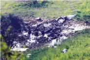  ?? THE ASSOCIATED PRESS ?? Israeli security stands around the wreckage of an F-16 that crashed in northern Israel on Saturday.