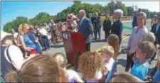  ?? CHRIS BARBER — DIGITAL FIRST MEDIA ?? A crowd surrounds state Rep. Stephen Barrar, R-160, and the Pocopson Vet Center mascot as Barrar gives credit to those who helped with a speedy repair and replacemen­t of the Route 926 bridge.