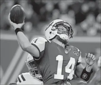  ?? BILL KOSTROUN/AP PHOTO ?? The New York Jets’ Ryan Fitzpatric­k is hit by Indianapol­is’ Hassan Ridgeway while throwing a pass during the first half of Monday’s game at MetLife Stadium. The Colts routed the Jets, 41-10.