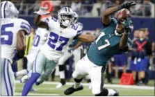  ?? MICHAEL AINSWORTH — THE ASSOCIATED PRESS ?? Eagles receiver Alshon Jeffery, right, makes a rather brilliant onehanded grab for a touchdown to help key a second half in which the Eagles outscored the Dallas Cowboys 30-zip Sunday night in Arlington, Texas.