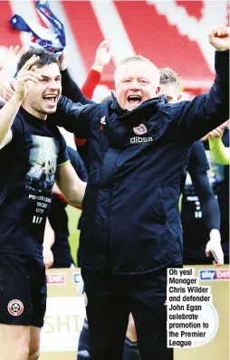 ??  ?? Oh yes! Manager Chris Wilder and defender John Egan celebrate promotion to the Premier League