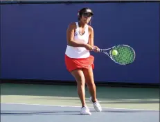  ?? Haley Sawyer/The Signal (See additional photos on signalscv.com) ?? Hart girls tennis singles player Mansi Sharma returns a hit in a match against Louisville in the CIF-Southern Section Division 3 tournament.