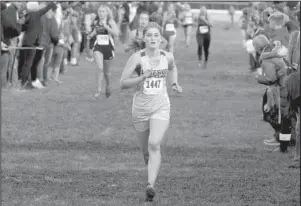  ?? The Sentinel-Record/Richard Rasmussen ?? FINISHING STRONG: Lakeside sophomore Natalie Jennings crosses the finish line for 13th place ahead of Lake Hamilton junior Meaghan Mears (left), who was 15th, in the Class 5A girls’ state cross country race at Oaklawn Park Friday.