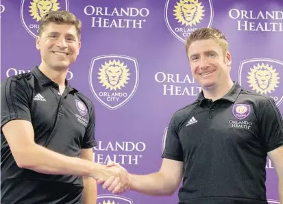  ?? JORDAN CULVER/STAFF ?? Orlando City GM Niki Budalic, left, introduces new coach James O’Connor during a press conference Monday at Orlando City Stadium.