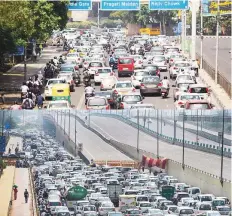  ?? ANI & PTI ?? Vehicles queue on New Delhi roads after restrictio­ns were
■ lifted during an extended lockdown in the country. In New Delhi, cyclists and private cars whizzed through thoroughfa­res that had been almost entirely deserted a day earlier.