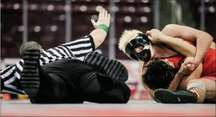  ?? NATE HECKENBERG­ER - FOR MEDIANEWS GROUP ?? Boyertown’s Jacob Miller gets the hand slap against Mifflin County’s Aaron Henry in the second period at 220 pounds.