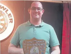  ??  ?? Terry Roach celebrates winning the Widnes & District Darts League’s Halton Stadium 501 Individual­s title.