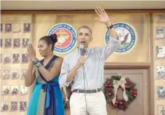  ?? — AFP ?? US President Barack Obama addresses troops with First Lady Michelle Obama at Marine Corps Base Hawaii in Kailua on Sunday.