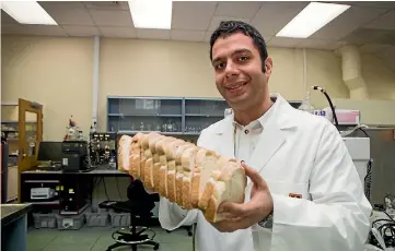  ?? PHOTO: DOMINICO ZAPATA/ STUFF ?? Dr Aydin Berenjian is taking unsold bread and putting it through a fermentati­on process to create a new loaf.