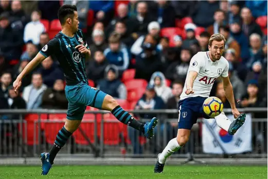  ??  ?? Leading figure: Tottenham’s Harry Kane making a cross during the English Premier League match against Southampto­n at Wembley on Tuesday. Tottenham won 5-2. — AFP