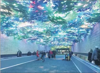  ?? KELLY YAMANOUCHI/STAFF ?? “Flight Paths” by Steve Waldeck was installed last year in the undergroun­d passenger walkway and between Concourses A and B at Hartsfield-Jackson Internatio­nal Airport.