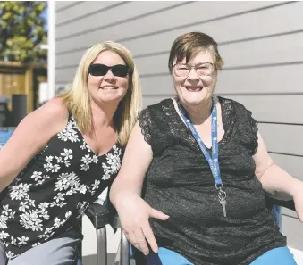  ?? JULIA PETERSON ?? Jannah Nicholson, left, manager of community inclusion for Elmwood Residences, celebrates with Delores Brock at the grand opening of three new group homes in the city.