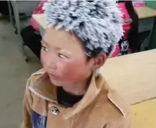  ??  ?? A teacher at the boy’s school in southern China shared a photo of him covered in frost after a 4.5-kilometre trek to school on a frigid day.