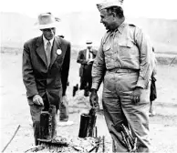  ?? TheAssocia­te
dPresfiles ?? Dr. J. Robert Oppenheime­r, left, and Gen. Leslie R. Groves survey the nuclear-test
site in Alamogordo, N.M., in 1945.