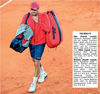 ?? — AFP ?? Switzerlan­d’s Roger Federer leaves the court after winning his third round match against Germany’s Dominik Koepfer at the French Open in Paris on Saturday.