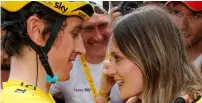  ?? Reuters ?? Geraint Thomas celebrates after winning the Tour de France title with his wife Sara Elen Thomas in Paris. —