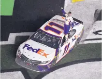  ?? PHELAN M. EBENHACK/ASSOCIATED PRESS ?? Denny Hamlin celebrates after winning the NASCAR Daytona 500 auto race at Daytona Internatio­nal Speedway on Sunday. It was his second Daytona win in four years.